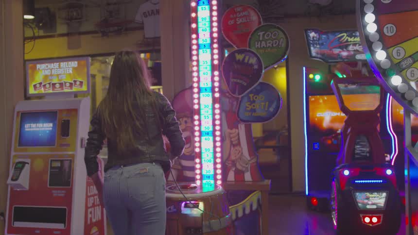 Girl playing arcade games