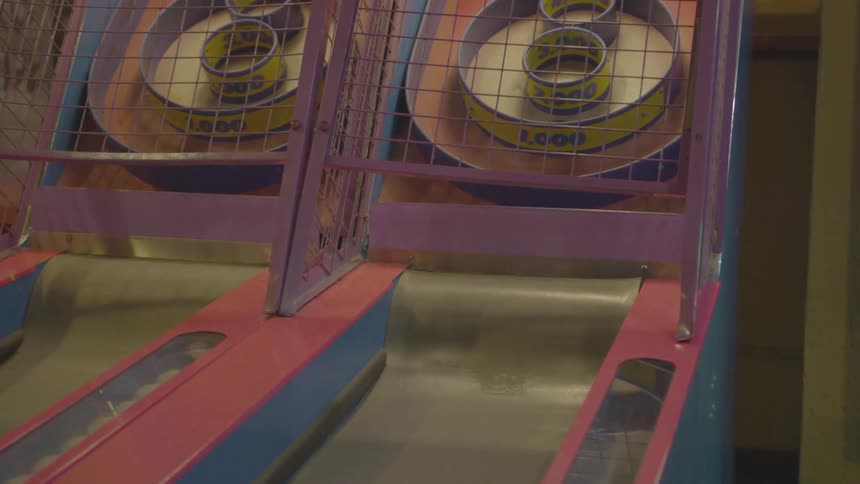 Girl playing an arcade game
