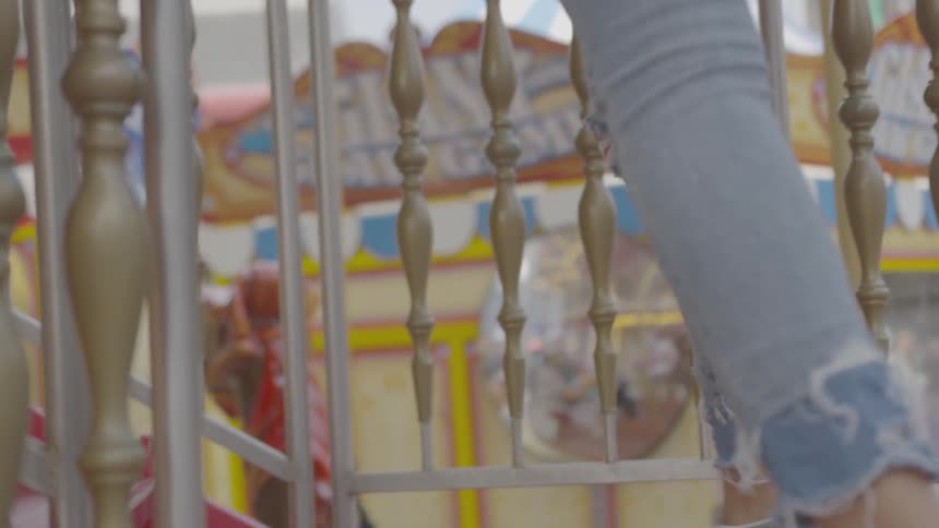 A woman walks up stairs on a ride