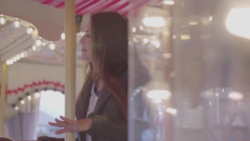 Woman dancing on a carousel