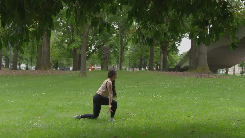 A woman doing yoga in a field
