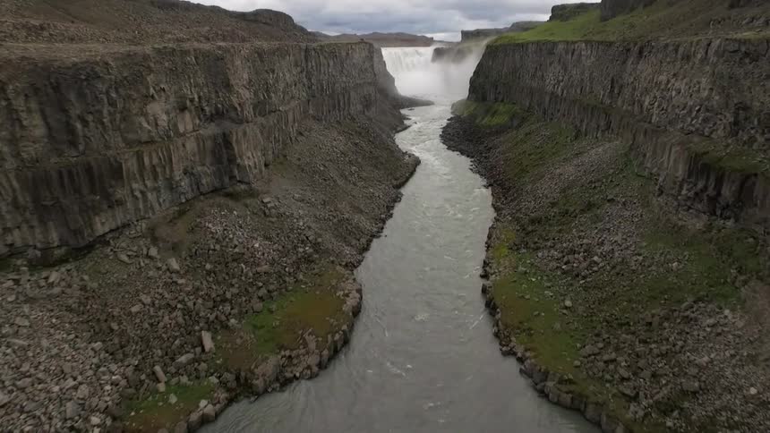 View of a river flowing through cliffs