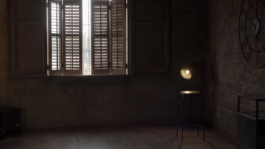 Dark room with partly open shades