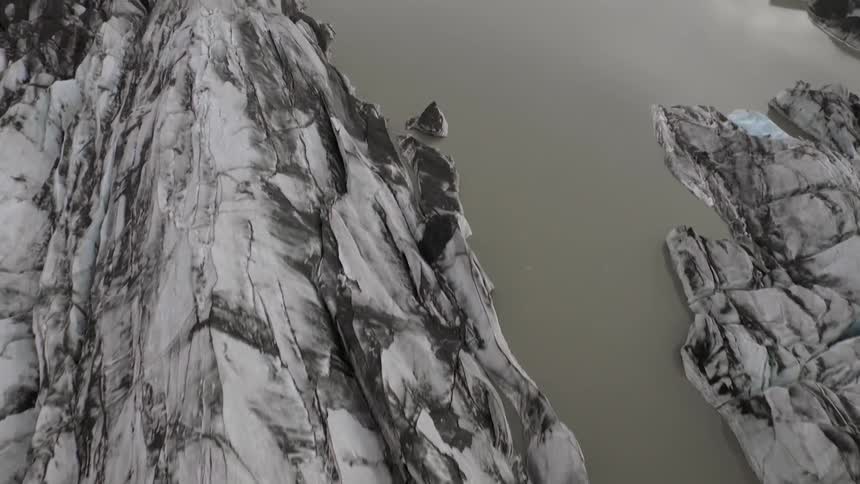 Aerial view of jagged rocks and a body of water