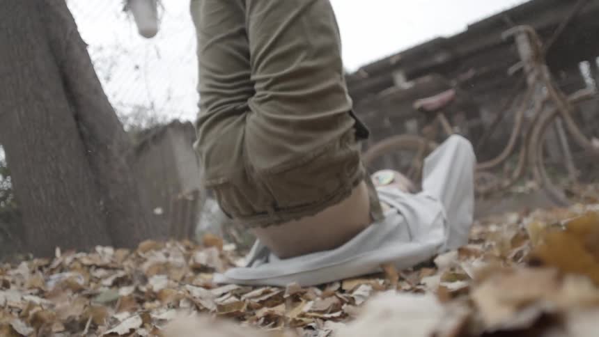 A breakdancer lands on his back and flips back up