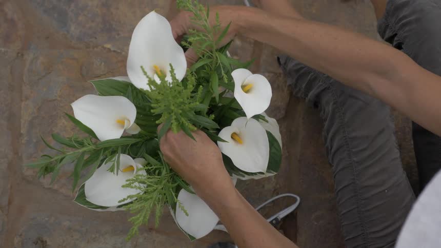 Woman making a flower arrangement