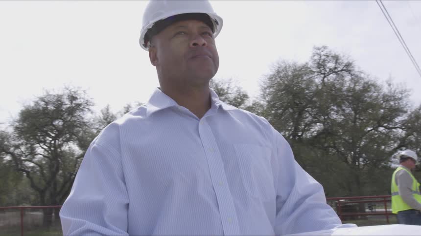 A man looks at the details before working on a project