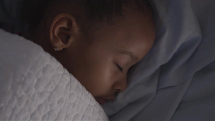 Girls eyelids move as she sleeps