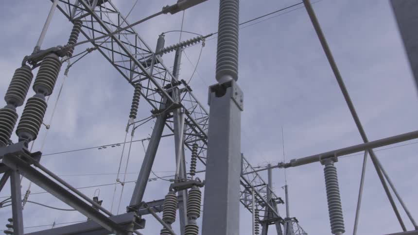 Power lines under a cloudy sky