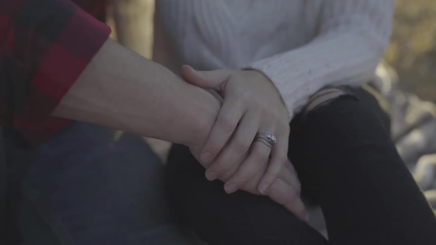 Man and woman holding hands