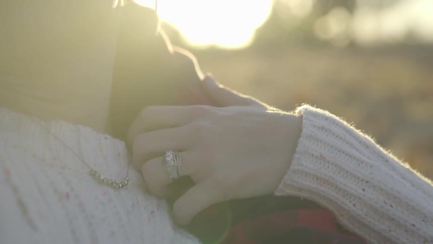 Woman strokes hand