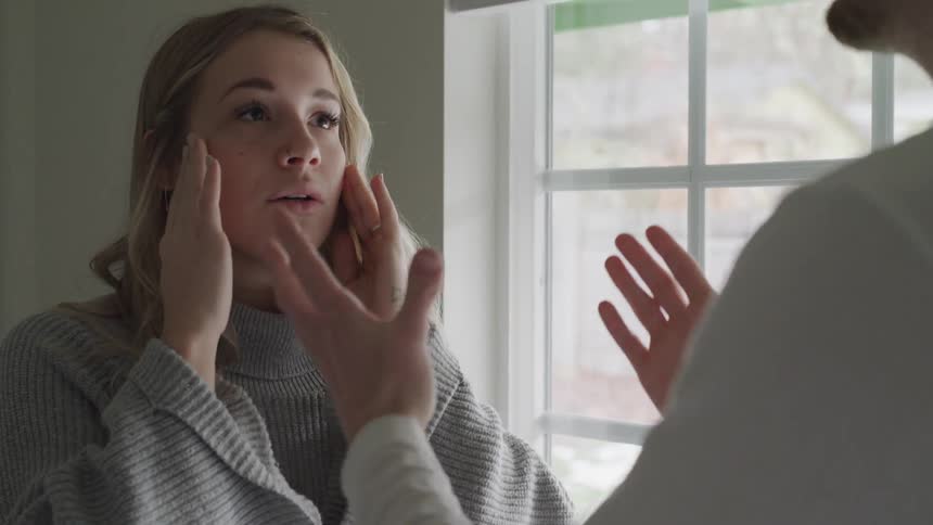 Man speaks to woman angrily as she looks sad