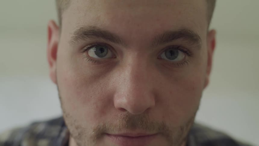 A man looks up and stares straight ahead