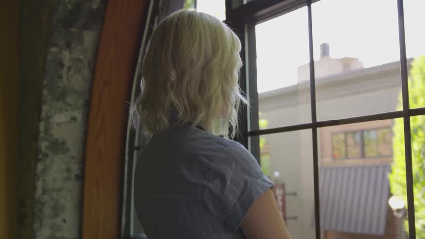 Woman looking out a window
