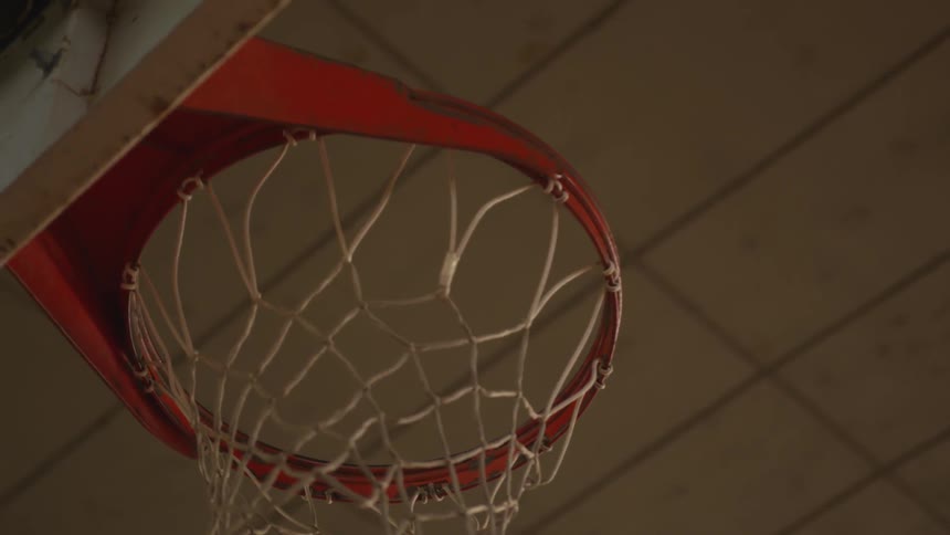 A basketball hoop is in the auditorium