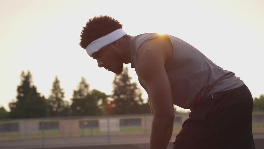 A man runs sets on the field