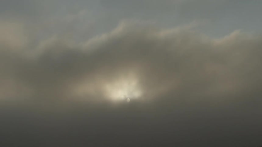 Sun shining through thick clouds