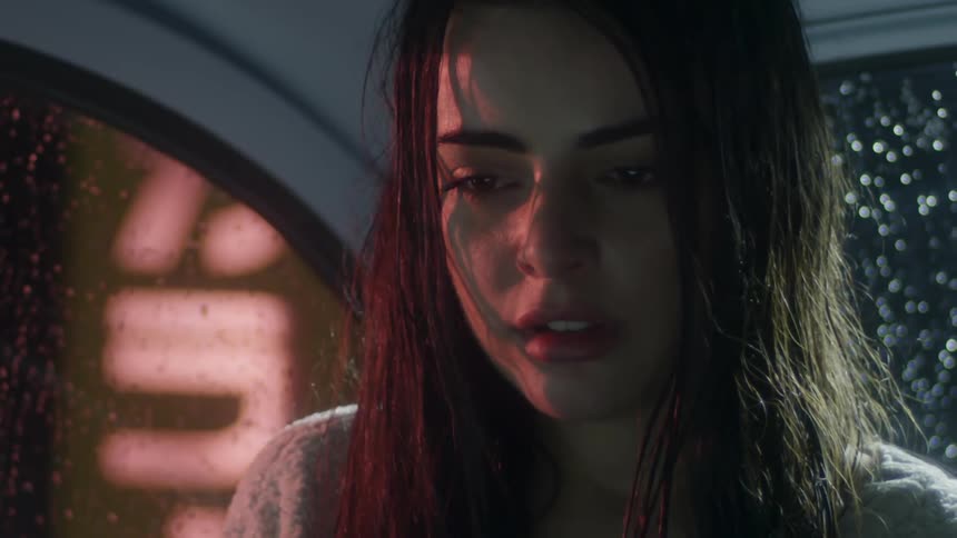 Girl in the back of a car during a rainy night
