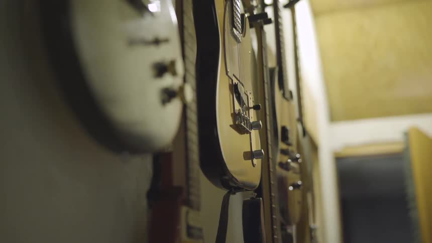 Electric guitars hand on a wall