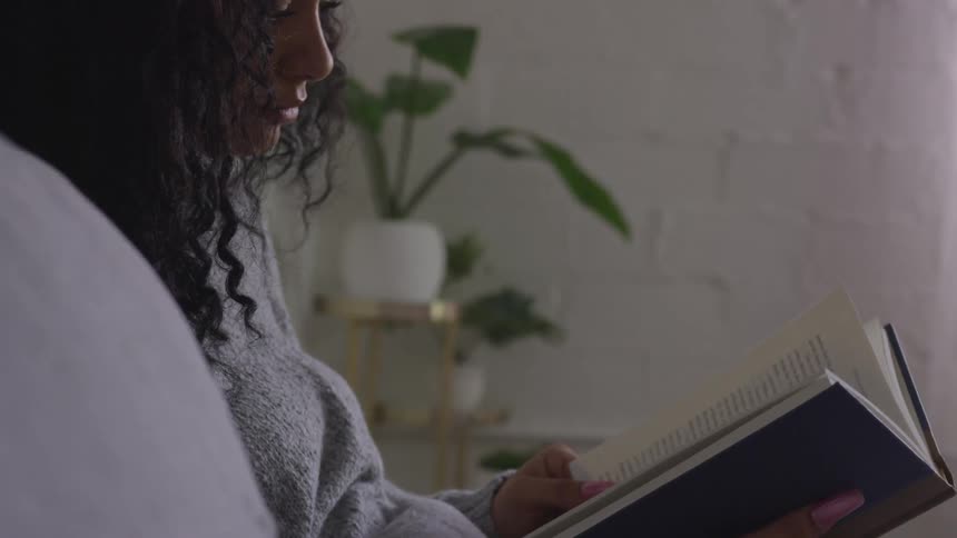 A woman is reading a book