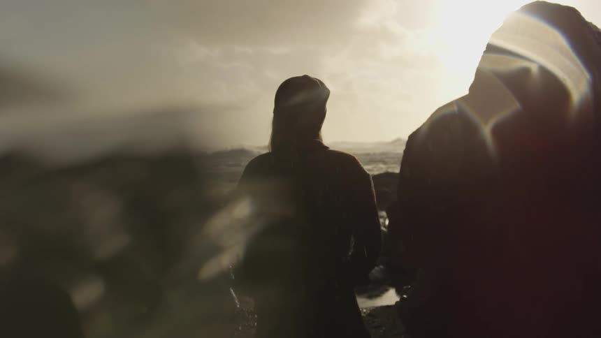 Its a man and shadows maybe rain hesd just standing there with blurs and lights all around