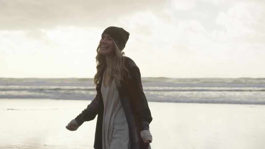 Girl standing on the beach