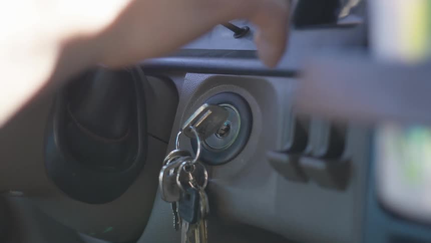 A man checks the gears on his car