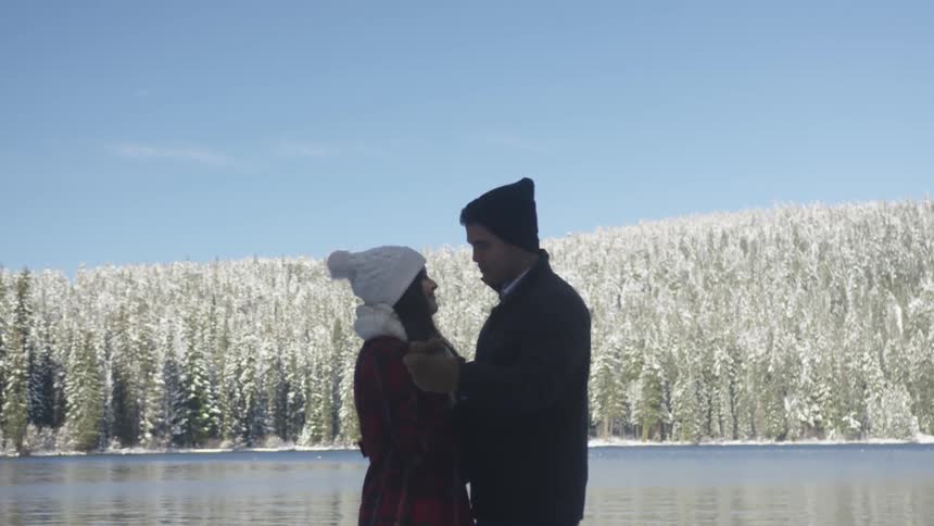 A man and woman dance outside