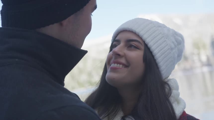 A couple looks at each other lovingly