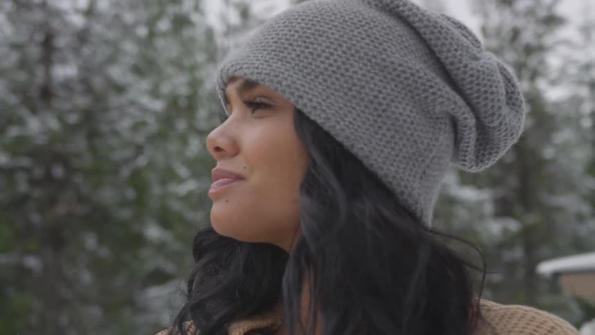 A woman stares off into the distance