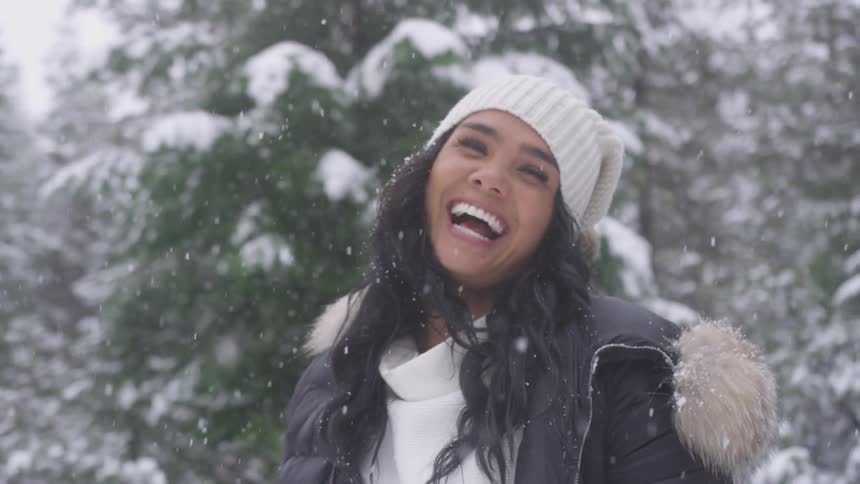 Woman laughing and smiling in the snow