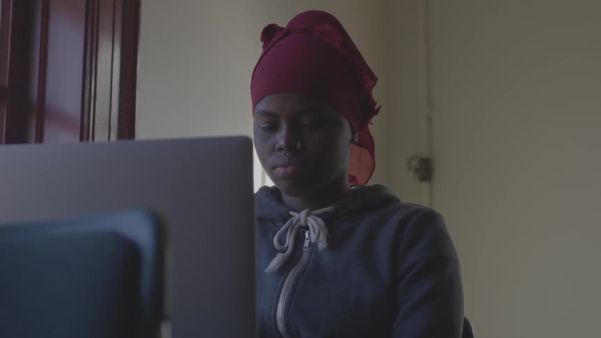 A person is sitting in front of a computer