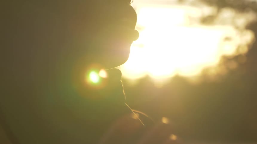 Woman prays outdoors