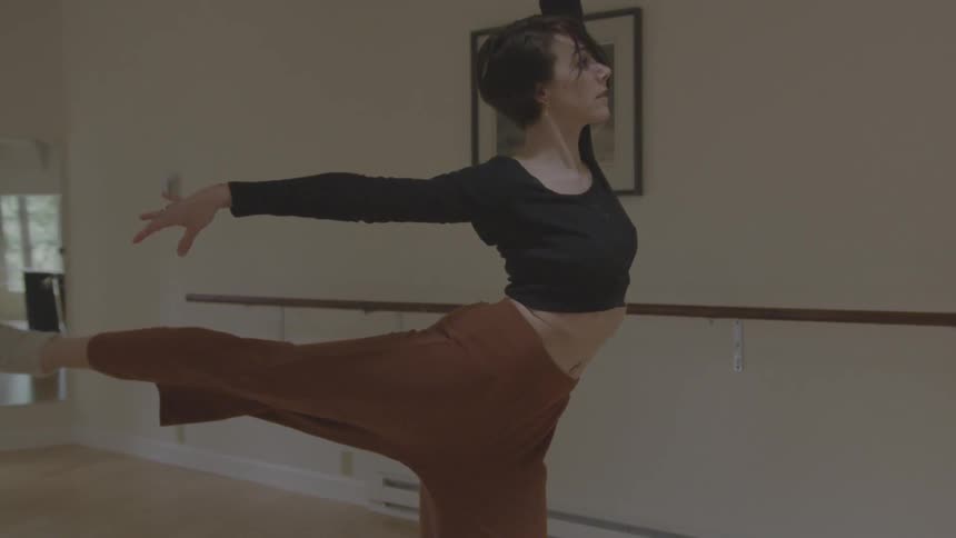 A woman dances in studio