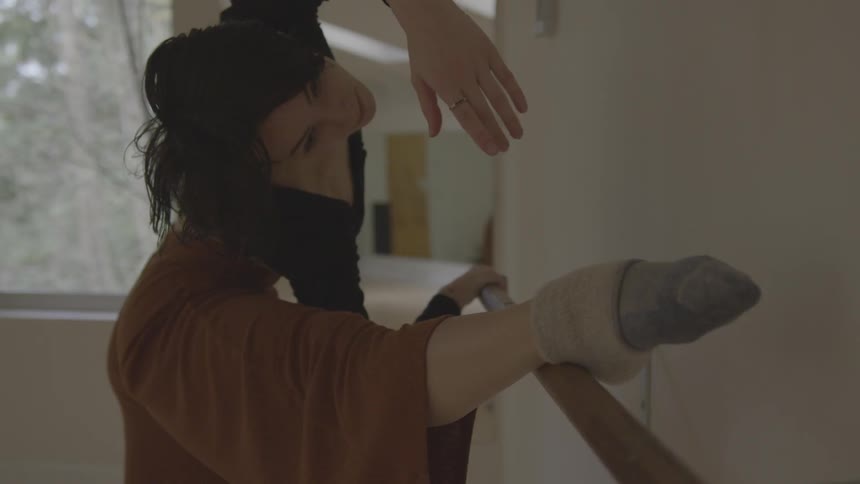 Woman practices ballet