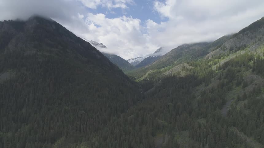 Landscape of the mountain valley with cloudy sky during daylight