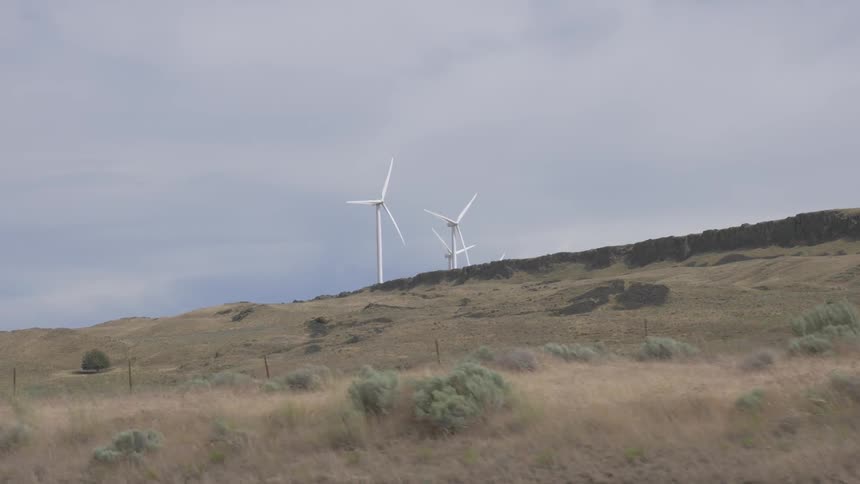 Countryside with wind turbines on it