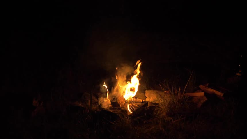 Bonfire burns brightly in the dark