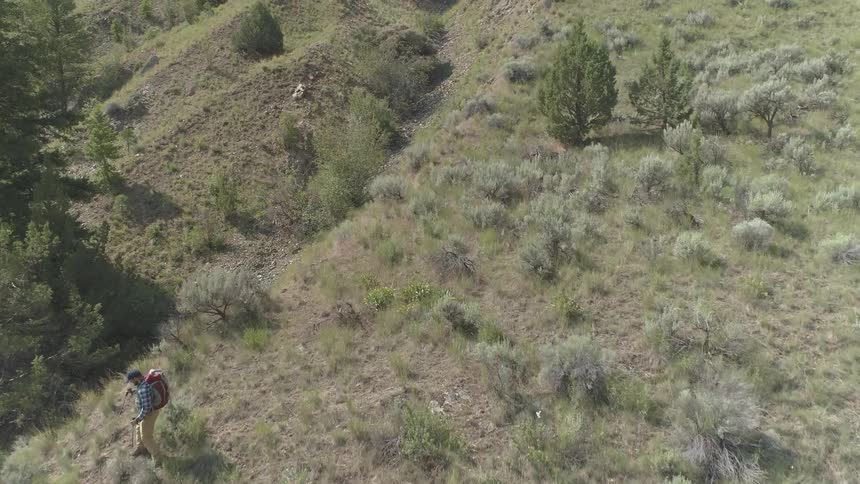 A male caucasian hiking on mountains