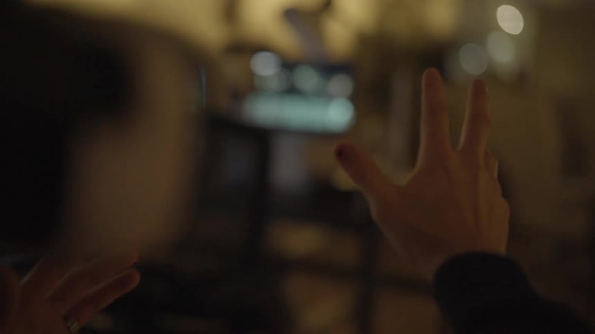 A man stretches his hand out in front of him