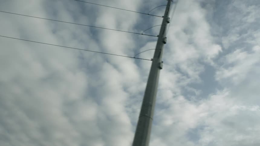 Electrical wires and the cloud full of large fluffy clouds