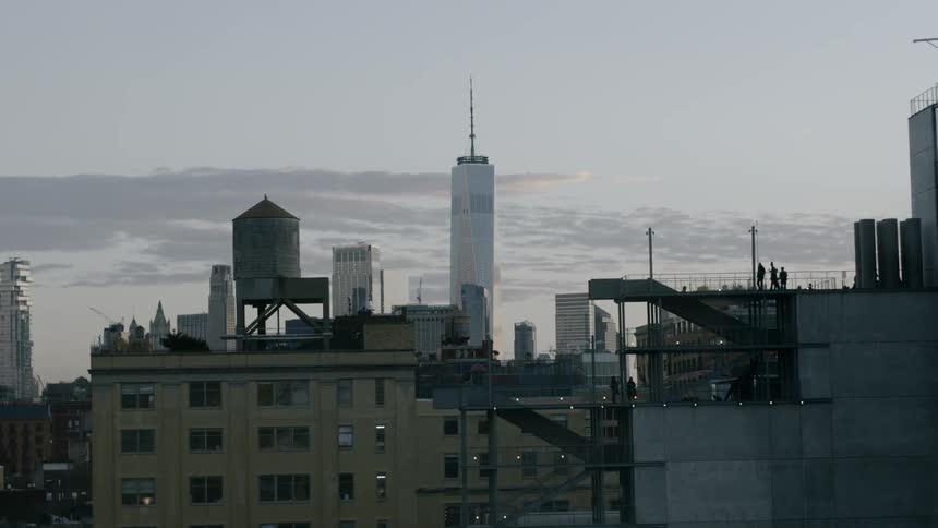 People walk on the roof of a building in the city