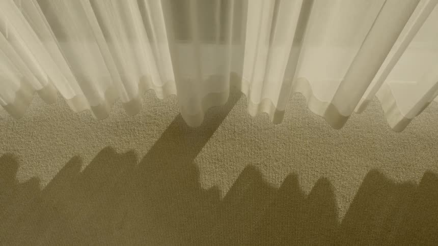 Aerial view of a carpet and curtains
