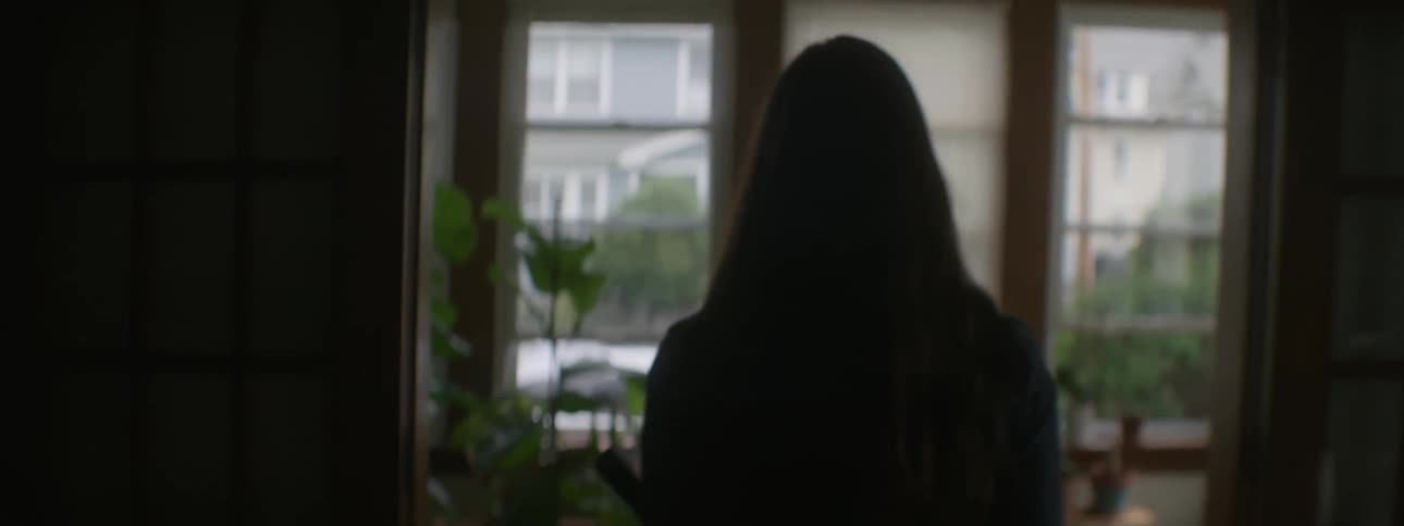 Woman walking to front door