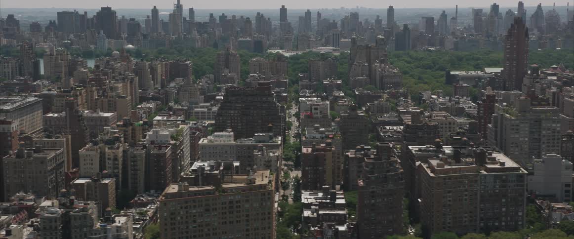 The camera flies across a large metro city