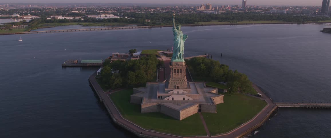 Statue of liberty with city in background