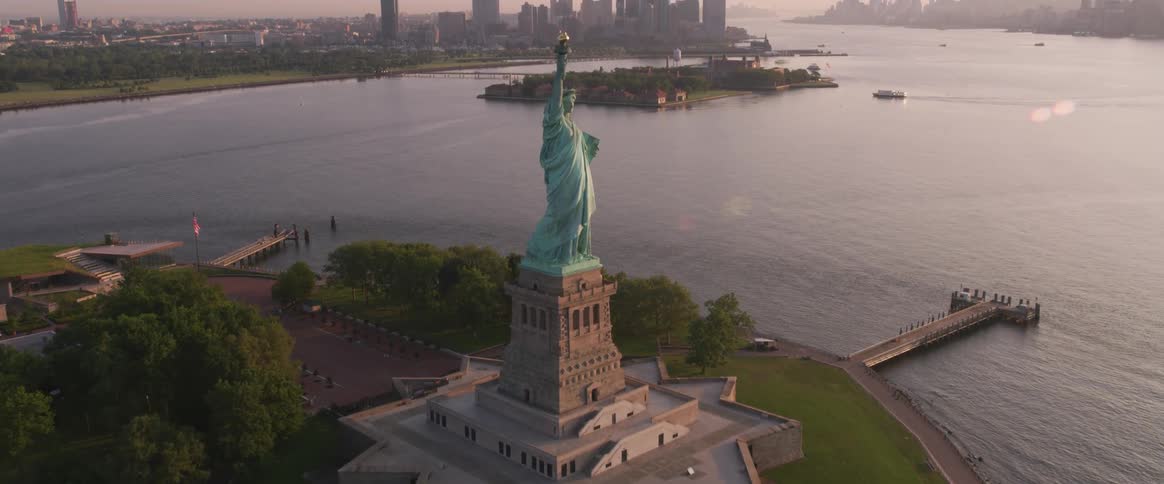 Statue of liberty with new york city on the horizon