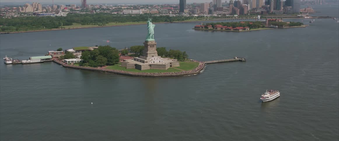 Ferry passes near the statue of liberty