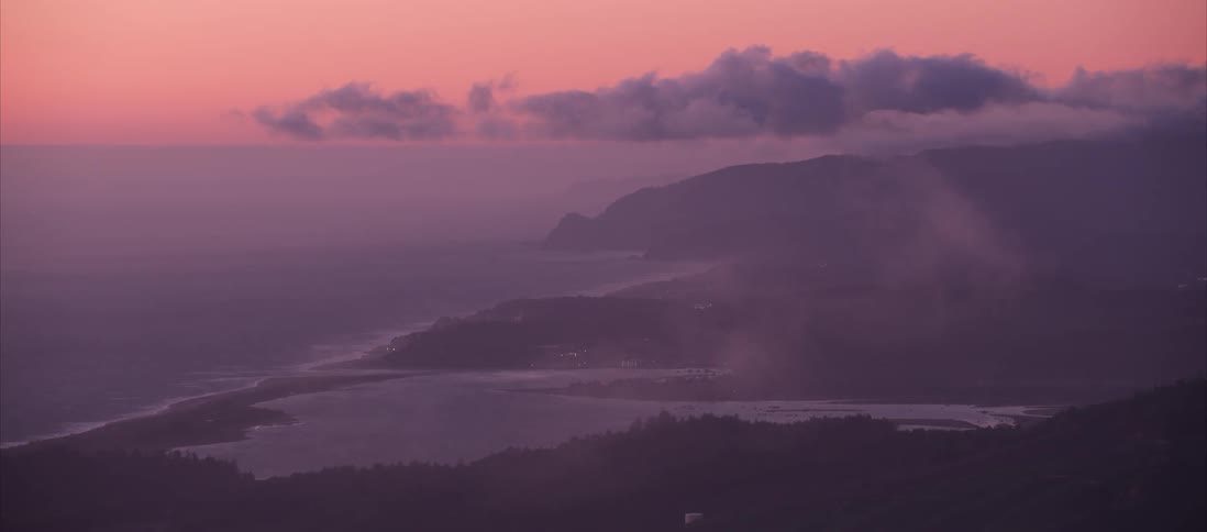 Aerial view of the waterfront and hills