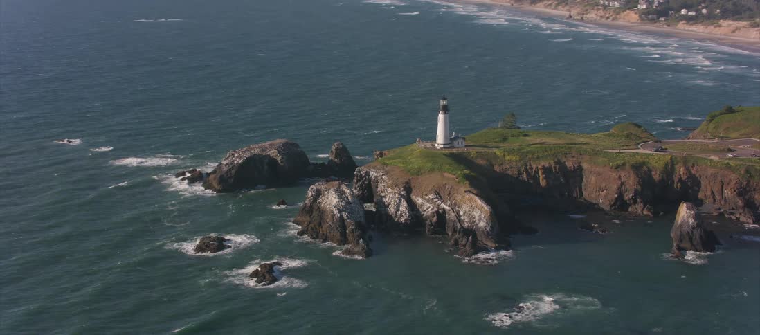Skyline view of the ocean and a lighthouse